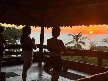 Sunset yoga on the open-air Treehouse deck